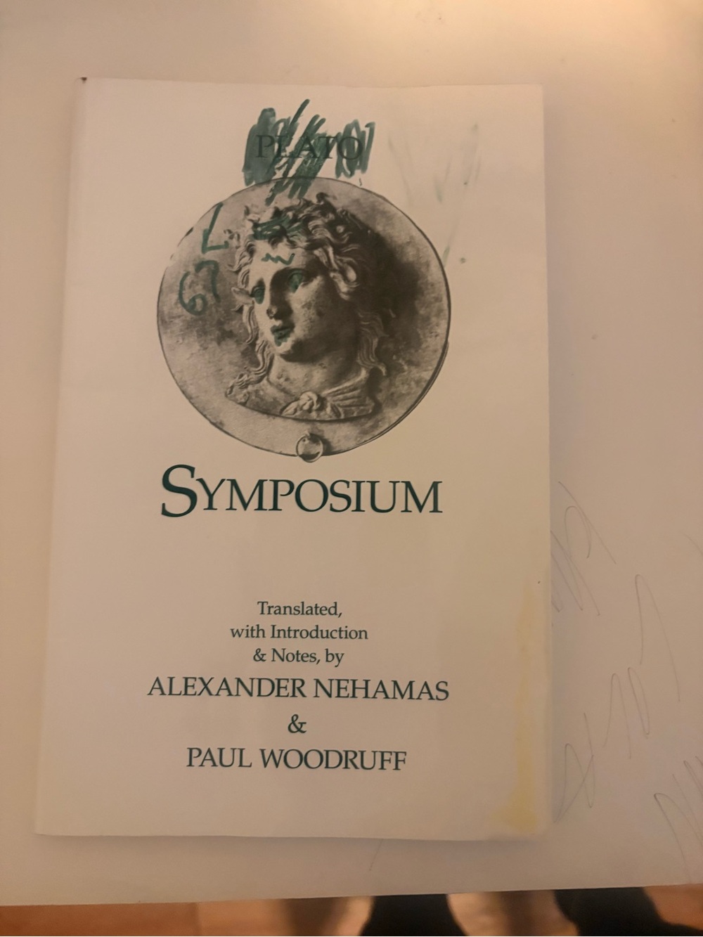 Symposium Paperback Book - Green Text and Illustration